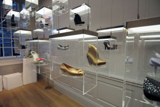 The Kinetic Structure is a series of 21 acrylic boxes, each filed with a single Melissa shoe. These rise and fall slowly and softly, in a variety of computer controlled patterns