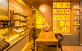 The honeyed hues of the backlit wall contain natural ingredients used in Burt's Bees product range