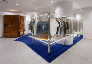 The glass partition creates a semi enclosed space, within the Dover Street Market, for clothing brand Kolor 