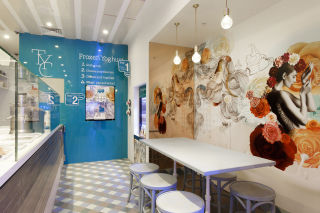Making the most of every square-inch, elegant graphics were designed and applied as a feature wall mural, packing a punch to the Yoghurt Club’s small tenancy. 