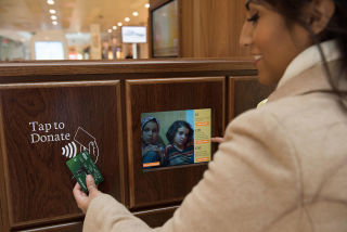 Electronic payment points throughout the space allow visitors to easily donate or begin a sponsorship