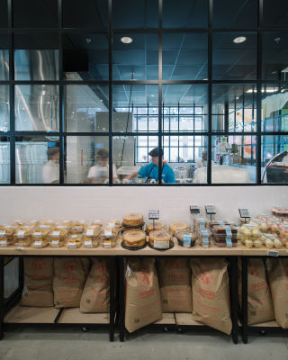 Open food prep areas allow visitors to glimpse the shop’s inner workings, creating openness and trust. 