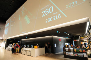 The store includes a futuristic take on today’s self-checkout systems. 