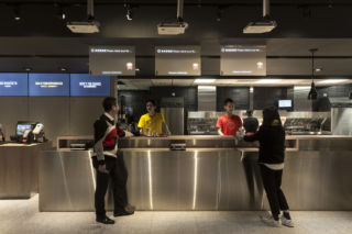 Traditional service and pickup points for take away orders are positioned adjacent to the self-service kiosks. 