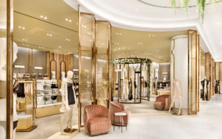 For Robinsons in Dubai, the lingerie department features rose-gold frame screens, washed timber fixtures and subtle grey hues, which creates a subtle distinction from the rest of the store
 