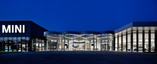 The Mini and BMW showroom spaces are connected by an architectural 'gasket', which is mirrored by the lighting in the events space inside