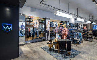 Wrangler's new concept store incorporates the brand's signature 'W' pocket motif into the design of the store's fixtures and fittings
