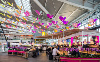 Itsu's brand butterfly is used to create a captivating lighting feature transcending the space above the restaurant. Light travels through the wings of each butterfly, giving the static centrepiece a sense of movement