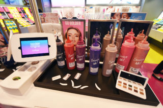 Digital displays offering tips and tricks help build confidence in trying new looks.