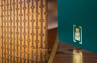 The 'bracket' device is used throughout We Are Bar's concept, as seen here in the perforated screen detail