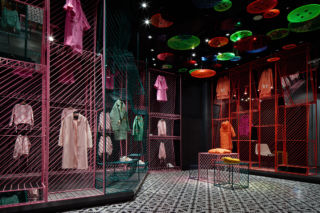 The button lighting and colourful metal mesh creates a playful urban environment for the hosting of multiple brands within the Fashionable Girl Collection in JOOOS Fitting Room