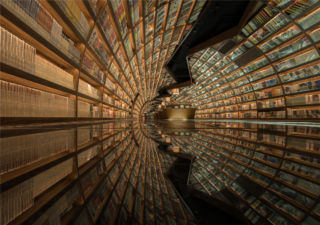 A reflective floor creates and equally impactful effect the mirror ceilings in another room of Zhongshuge's bookstore in Yangzhou