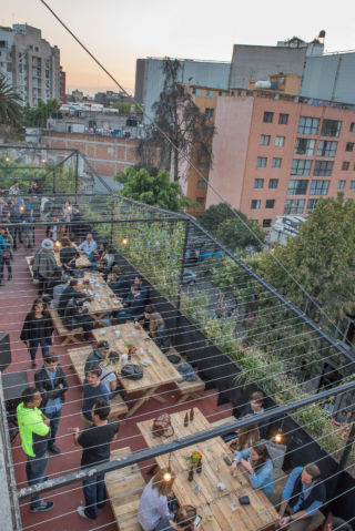 A rooftop bar and gathering space creates social connections.