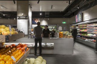 The produce section features a juice and salad bar, along with healthy food to-go.