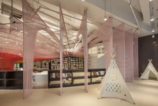 Tents provide visual interest and nooks for young visitors to read.