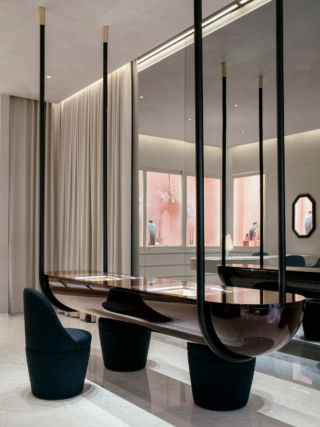 A beautiful suspended table with illuminated displays creates a feature in Nirav Modi's store in New York