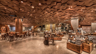 Hand-hewn ceiling tiles evoke the locking of an espresso shot on a machine. 