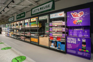 The 'Refill Zone' is the store's focal point where customers can buy loose goods. 