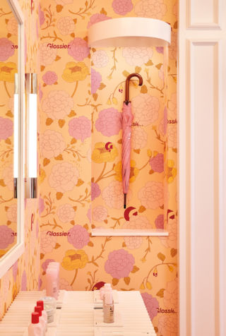 Sitting framed in an alcove like a work of art is Glossier’s limited-edition London umbrella, available to buy exclusively at the Glossier London pop-up shop.