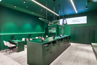 The strong use of brand green, elevates the customer consultation experience at Specsavers in Australia. 