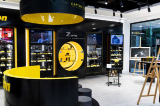 Great use of brand colours to highlight product ranges in Nikon's display at Ted's Cameras. 